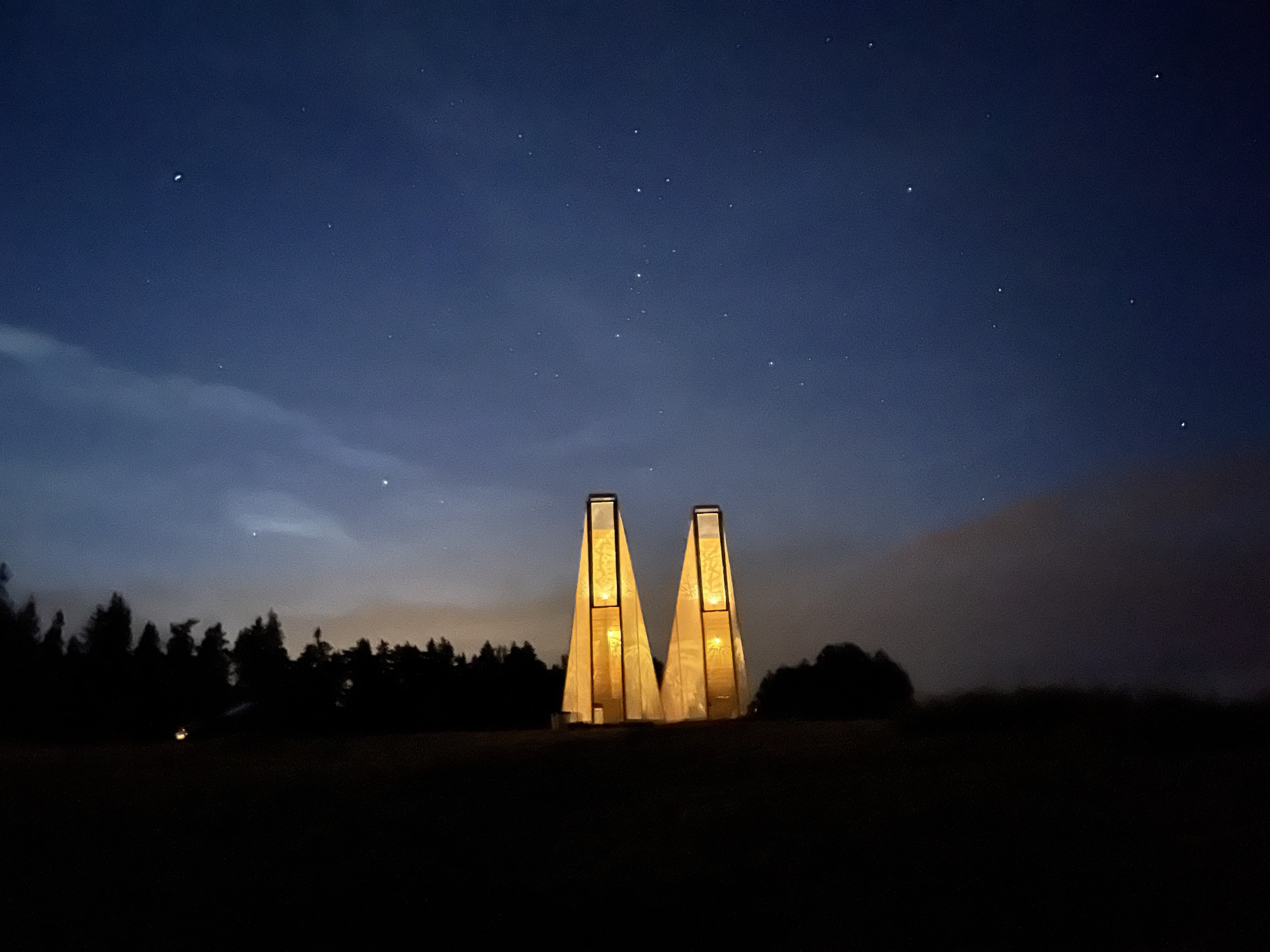 The Temple of Release lit at night at The Borderland