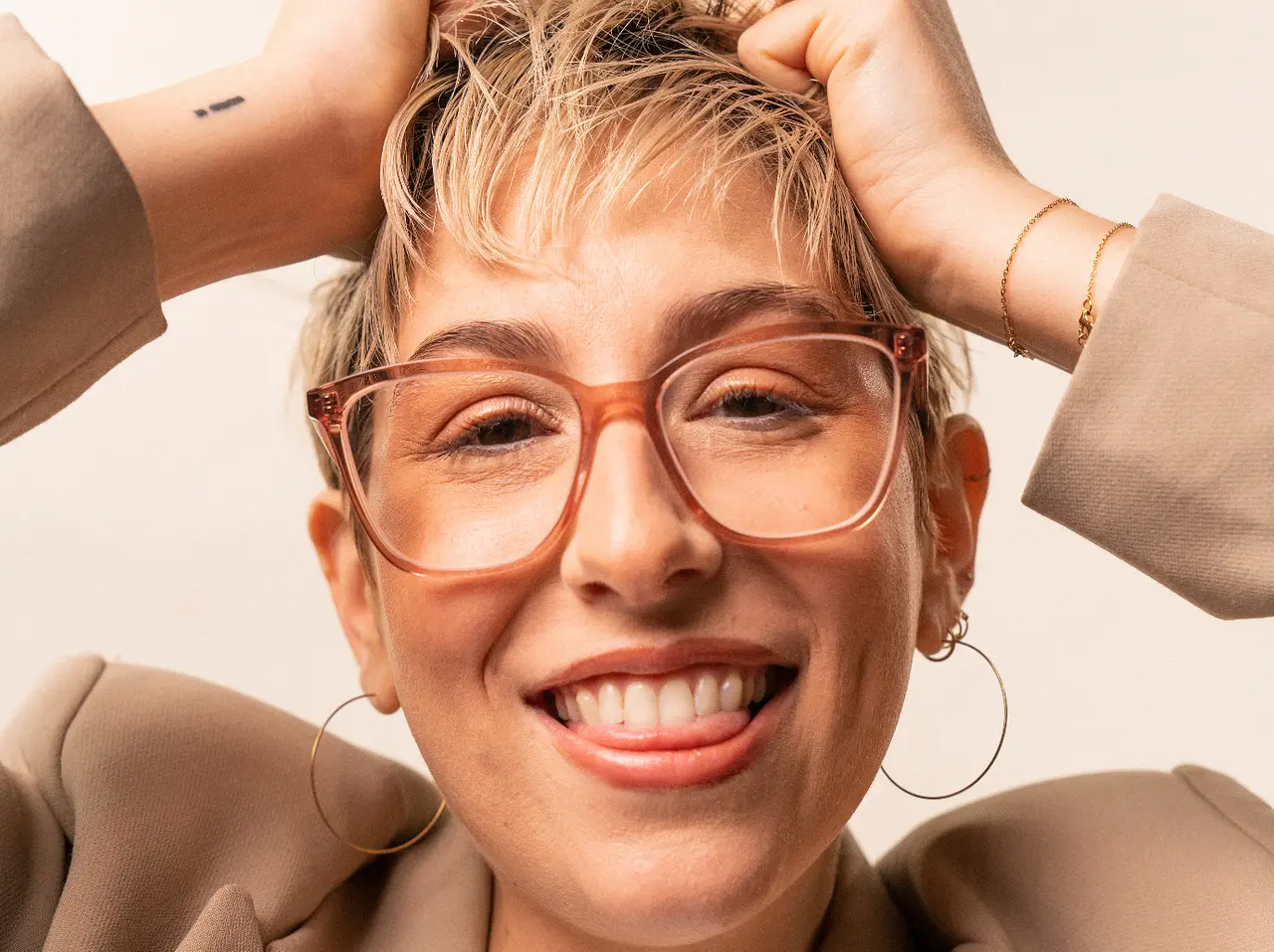 A customer laughing in a pair of Heywear frames